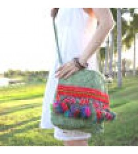 Green crossbody bag with colorful tassels