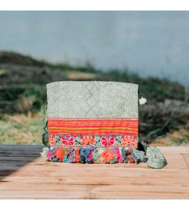 Green crossbody bag with colorful tassels
