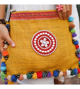 Yellow messenger bag with colorful pompom trim