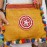 Yellow messenger bag with colorful pompom trim