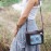 Black crossbody bag with blue pattern